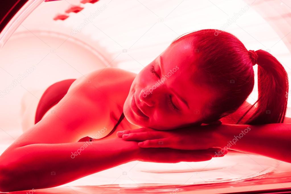 Woman on tanning bed.