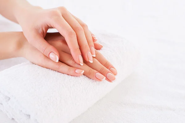 Female hands on the towel — Stock Photo, Image