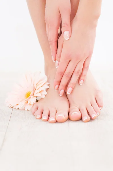 Woman touching her feet — Stock Photo, Image