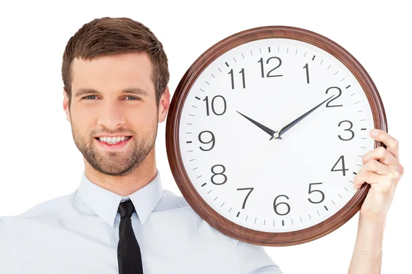 Man in formalwear holding a clock Royalty Free Stock Images