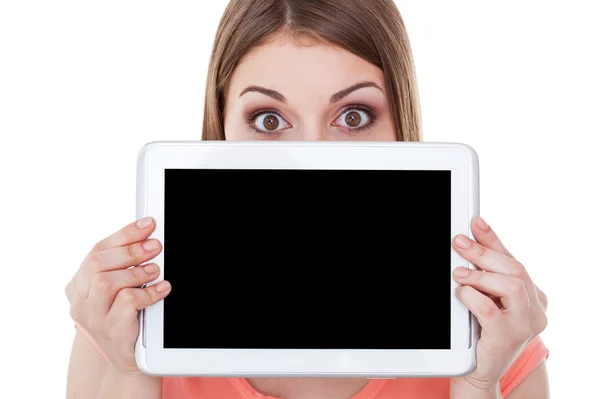 Woman looking out of  digital tablet — Stock Photo, Image