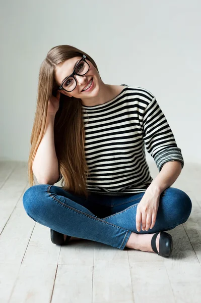 Young woman in striped clothing — Stock Photo, Image