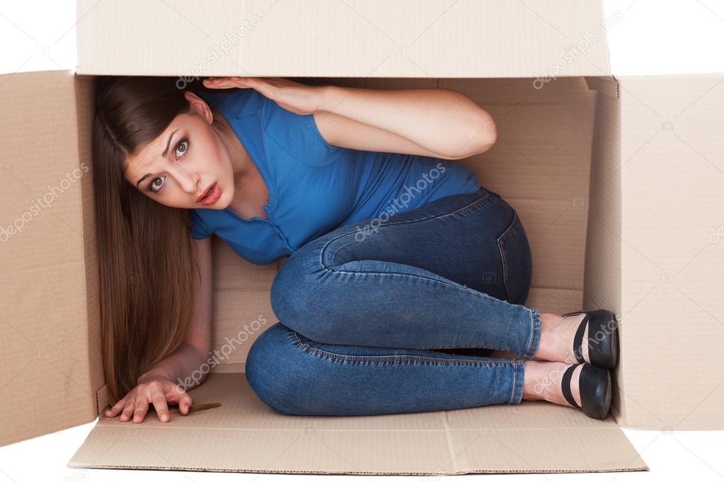 Woman in cardboard box