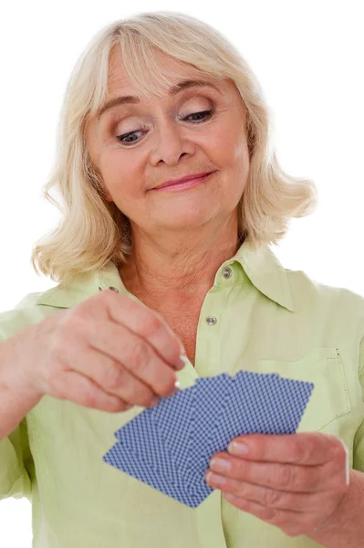 Senior lady playing cards — Stock Photo, Image