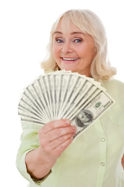 Senior woman stretching out paper currency — Stock Photo, Image