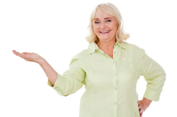 Senior woman holding copy space — Stock Photo, Image