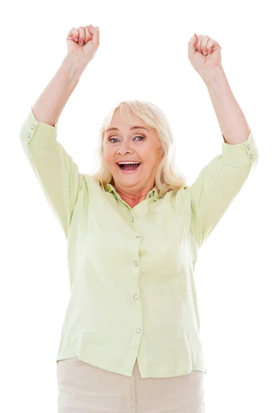 Happy senior woman keeping arms raised Royalty Free Stock Images