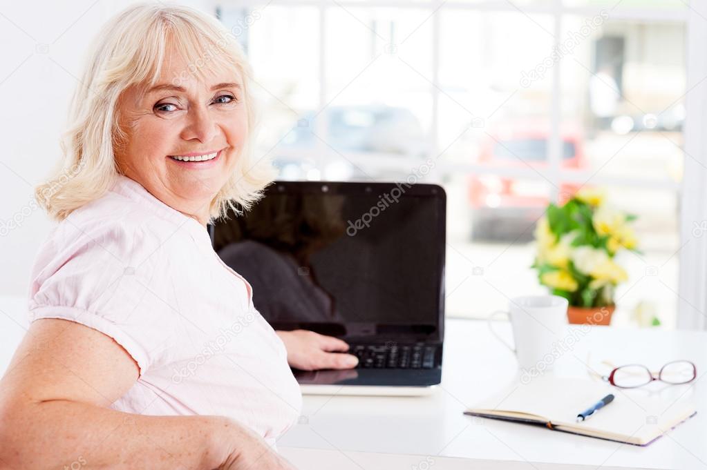 Senior woman working on laptop