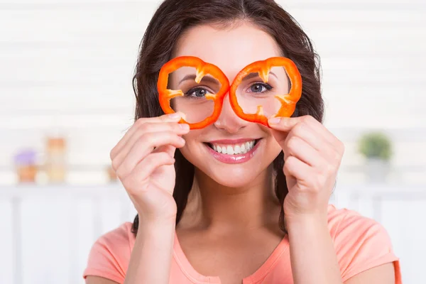 Woman looking through pieces of pepper — Stock Photo, Image