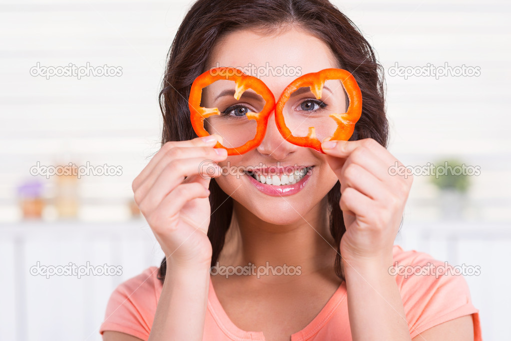 Woman looking through pieces of pepper