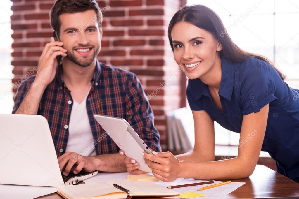 Man and woman sitting at the working place