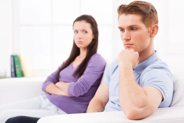 Depressed young man and angry woman — Stock Photo, Image