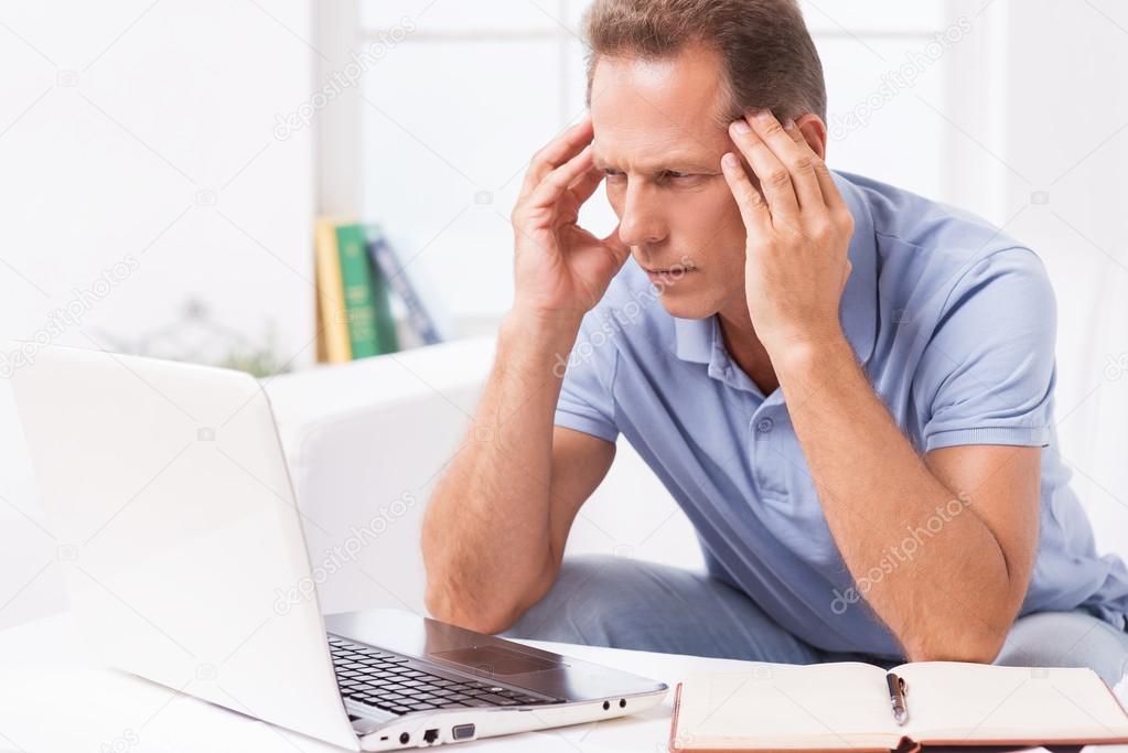 Man looking at laptop