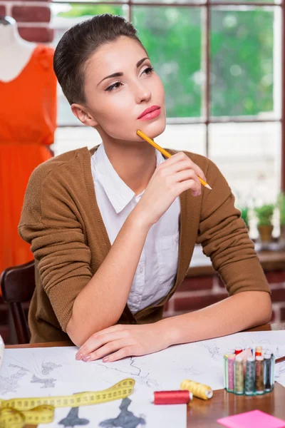 Fashion designer holding pencil — Stock Photo, Image