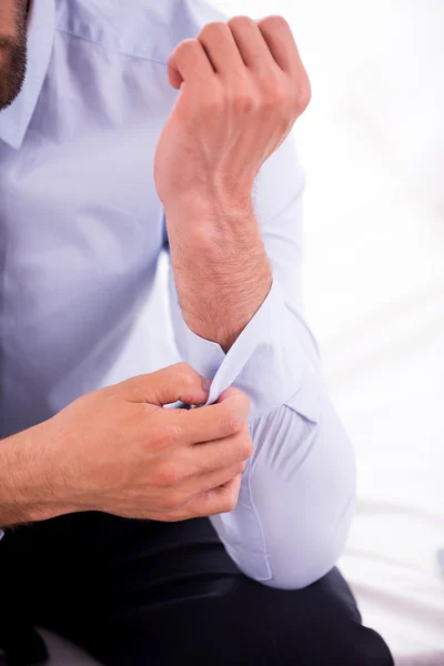 Adjusting shirt sleeves. — Stock Photo, Image