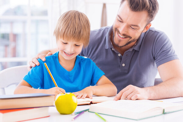 Father helping his son with homework