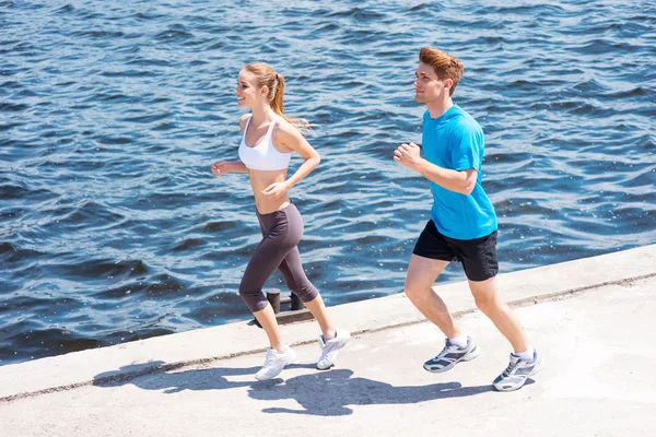 Woman and man jogging together. — Stock Photo, Image