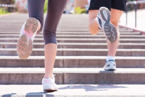 Woman and man jogging together. — Stock Photo, Image