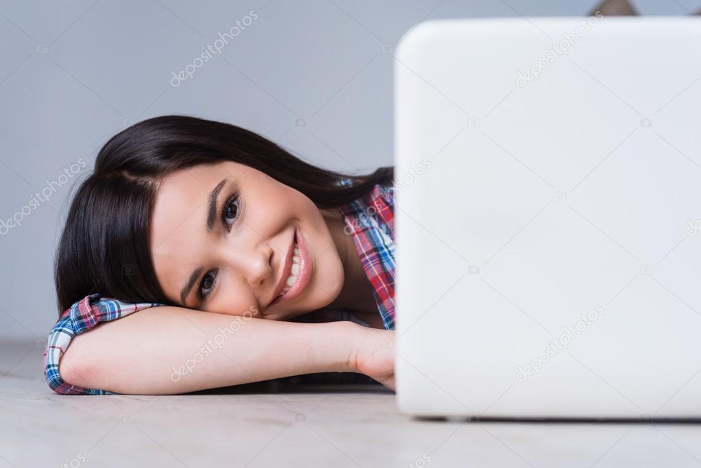 Woman looking out of laptop