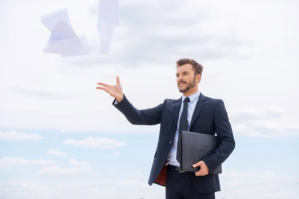 Businessman throwing documents away — Stock Photo, Image