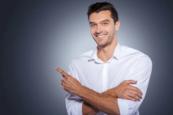 Man in white shirt pointing copy space — Stock Photo, Image