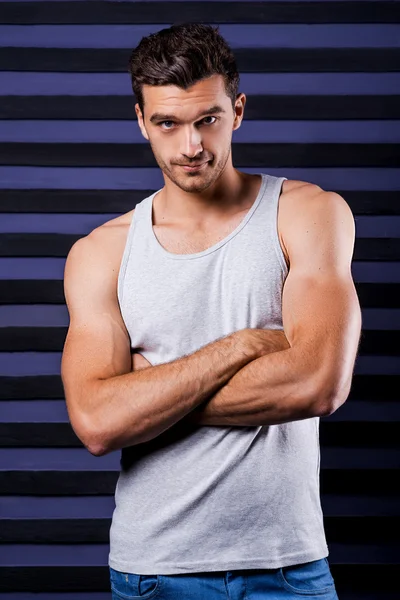 Man in tank top keeping arms crossed — Stock Photo, Image