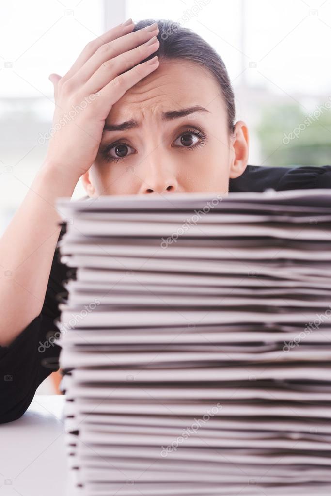 Woman tired of paperwork.