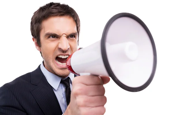 Homem de traje formal gritando ao megafone — Fotografia de Stock