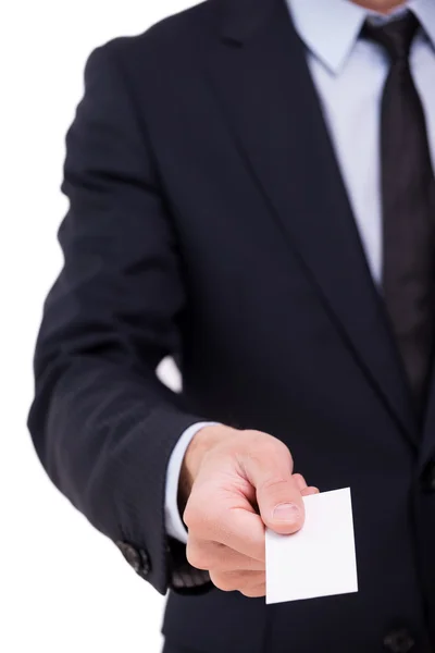 Businessman stretching out hand with business card — Stock Photo, Image