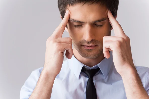 Man in shirt and tie touching head with fingers — Stock Photo, Image