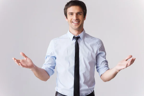 Man in shirt and tie gesturing welcome — Stock Photo, Image
