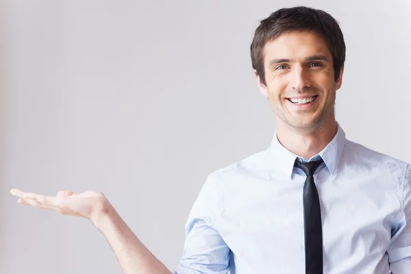 Businessman holding copy space. — Stock Photo, Image