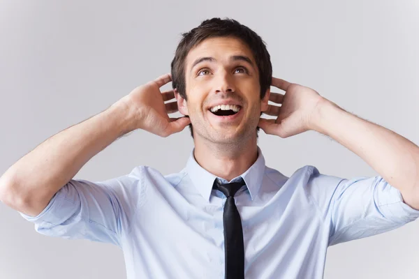 Man in shirt and tie touching head with hands — Stock Photo, Image