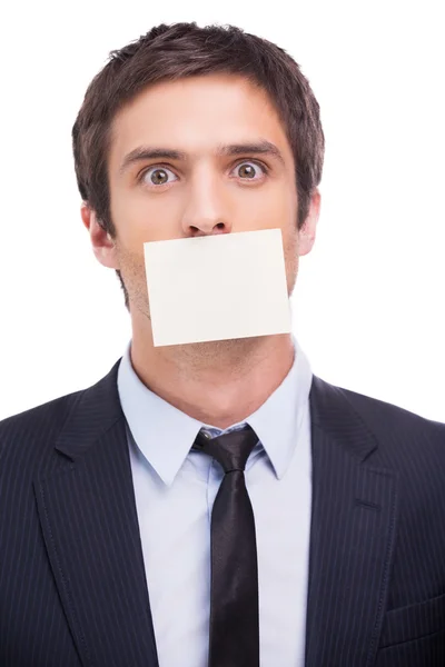 Man in formalwear and adhesive note on his mouth Stock Picture