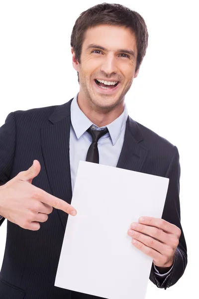 Man in formalwear holding blank paper Royalty Free Stock Photos