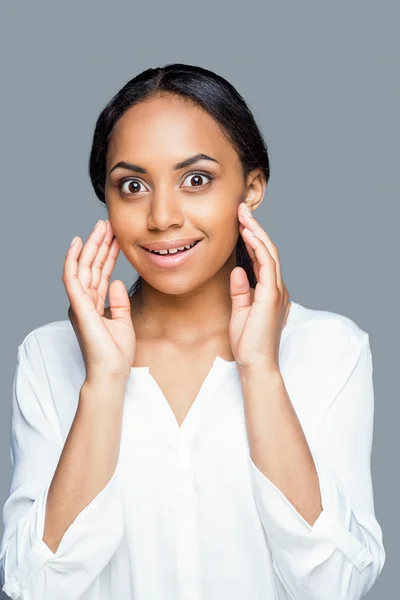 African woman touching her face with hands — Stock Photo, Image