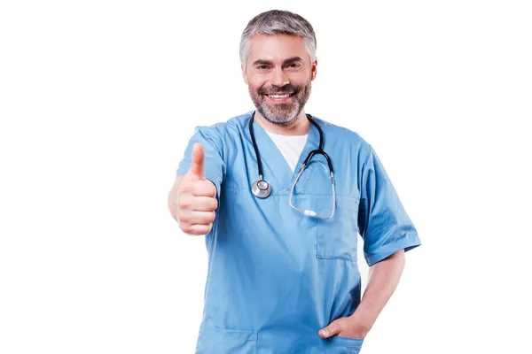 Surgeon in blue uniform showing thumb up — Stock Photo, Image