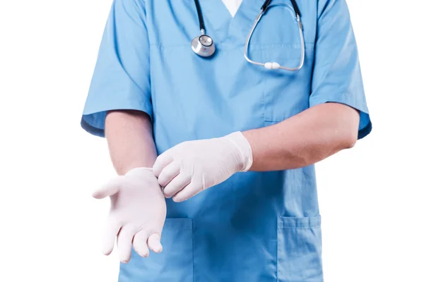 Surgeon wearing surgical gloves — Stock Photo, Image