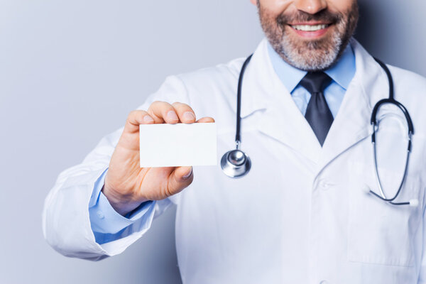Doctor showing his business card