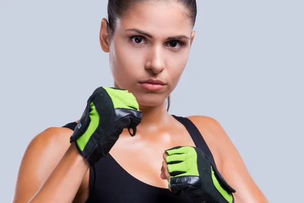 Sporty woman in sports gloves — Stock Photo, Image