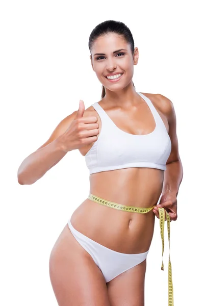 Woman in white bra and panties showing thumb up — Stock Photo, Image