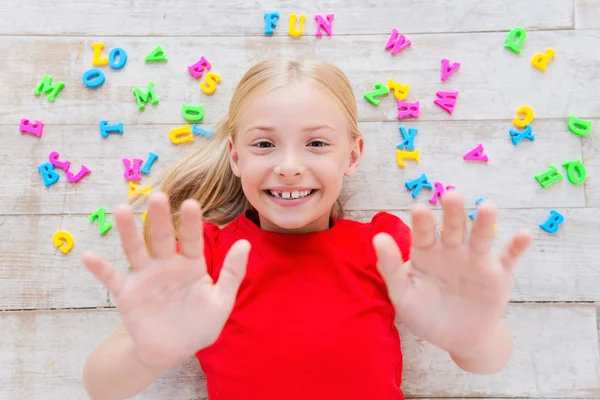 Girl stretching out hands — Stock Photo, Image