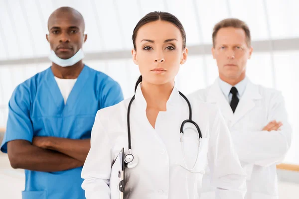 Female doctor with team. — Stock Photo, Image