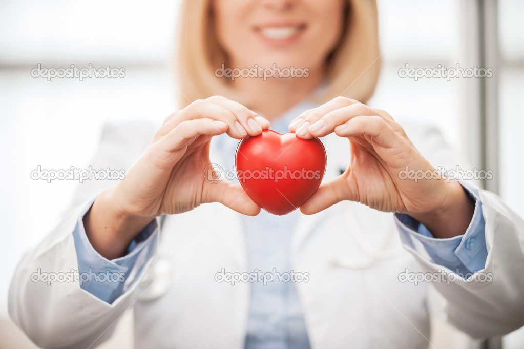 Female doctor  holding heart