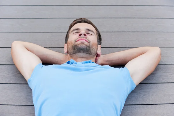 Handsome young man keeping eyes closed — Stock Photo, Image