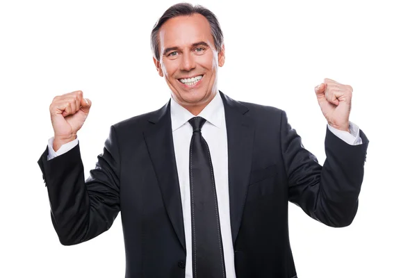 Happy mature businessman gesturing and smiling — Stock Photo, Image