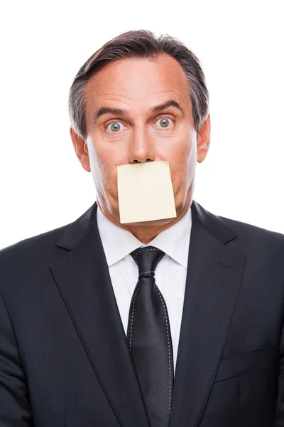 Frustrated businessman adhesive note on his mouth — Stock Photo, Image