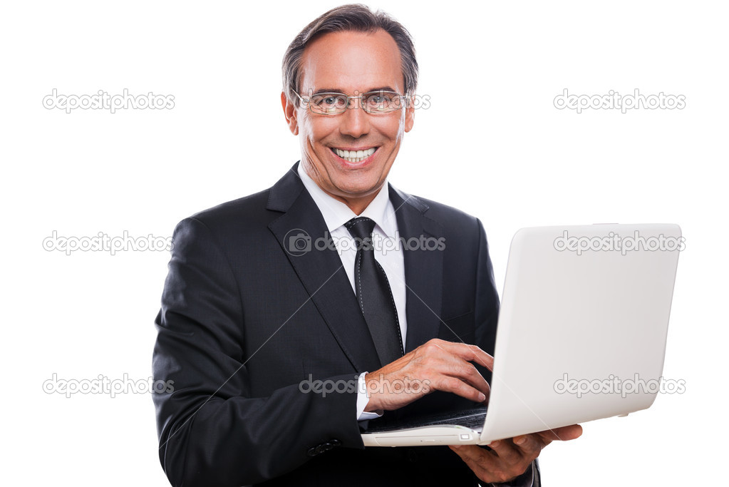 Mature businessman working laptop