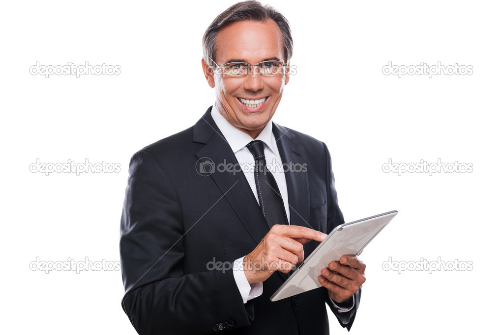 Businessman in formalwear working on tablet