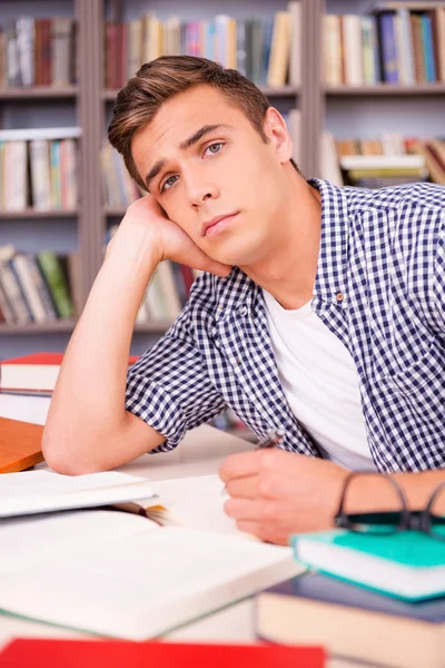 Young man leaning his face on hand — Stock Photo, Image